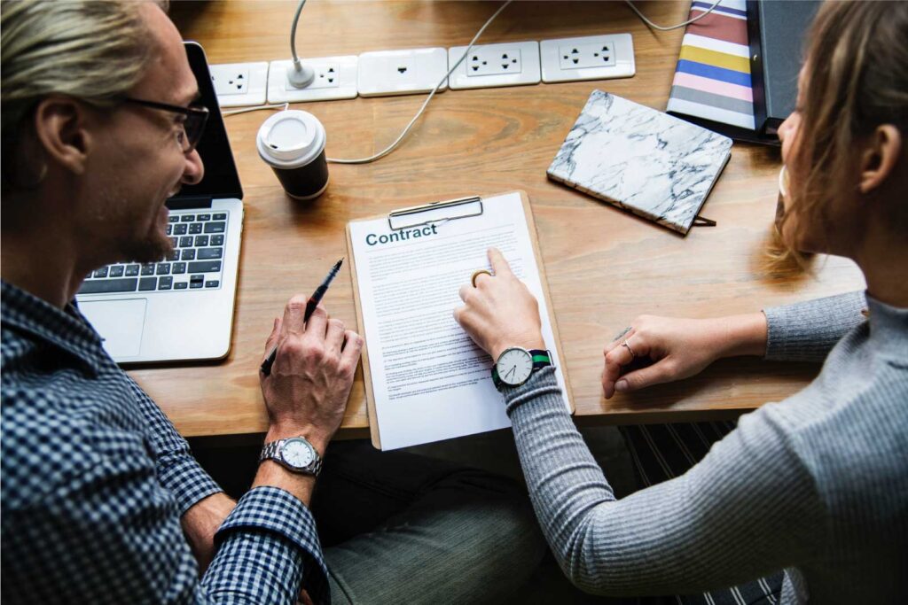 Man and woman reviewing a document together