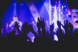 Silhouette raised hands at live concert